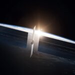 SpaceX rendering of a Starmind AI compute satellite with large solar arrays above Earth